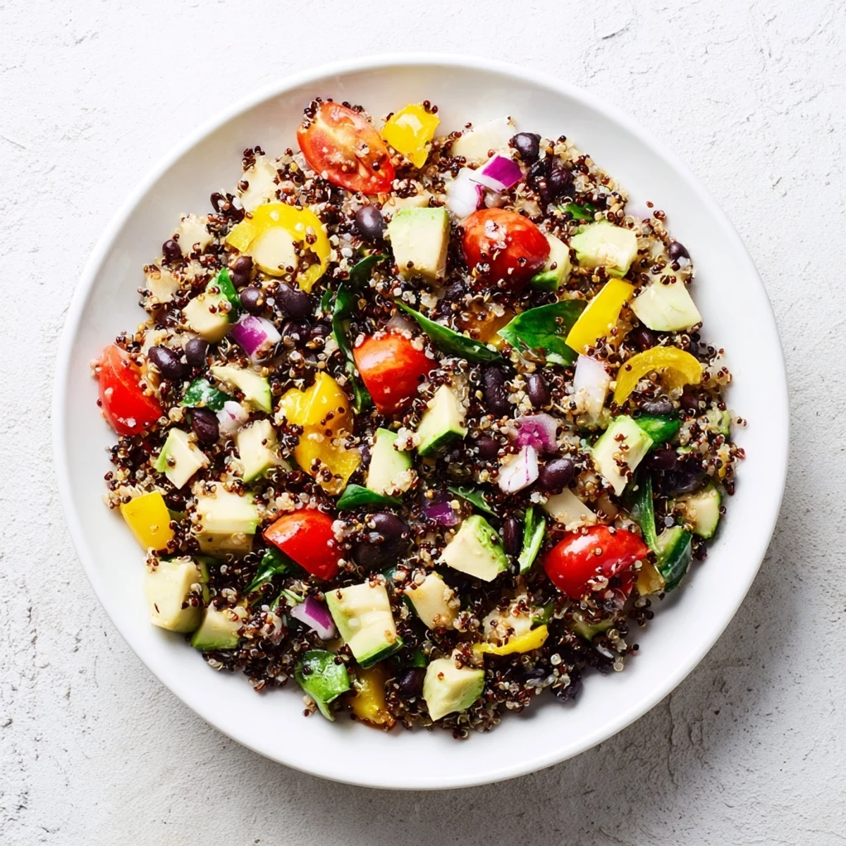Poppy-Bright Quinoa and Black Bean Salad: a bright, colorful bowl with vibrant vegetables, delicious and refreshing.