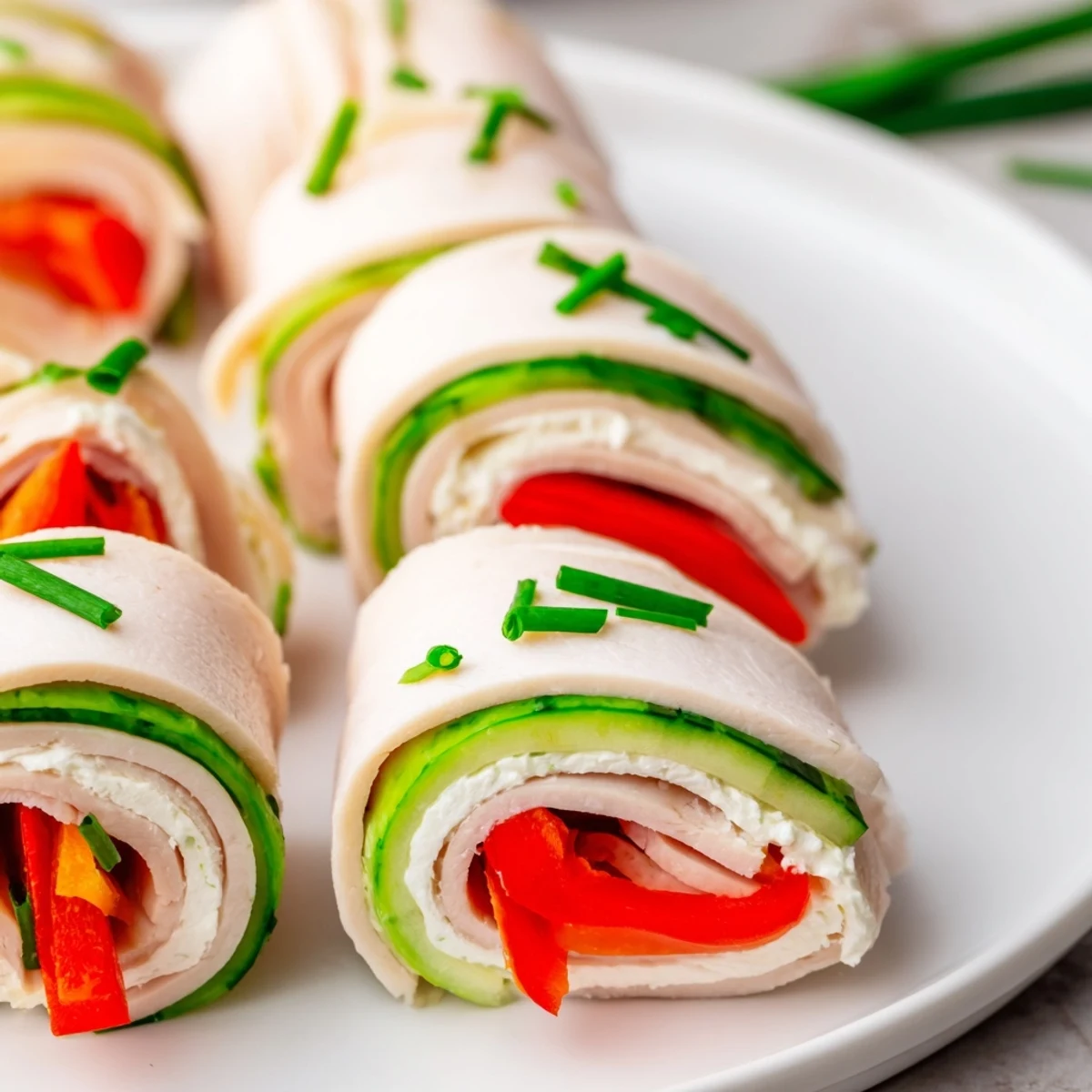 Appetizing shot of simple, protein-packed Turkey Roll-Ups ready to be enjoyed as a light lunch.