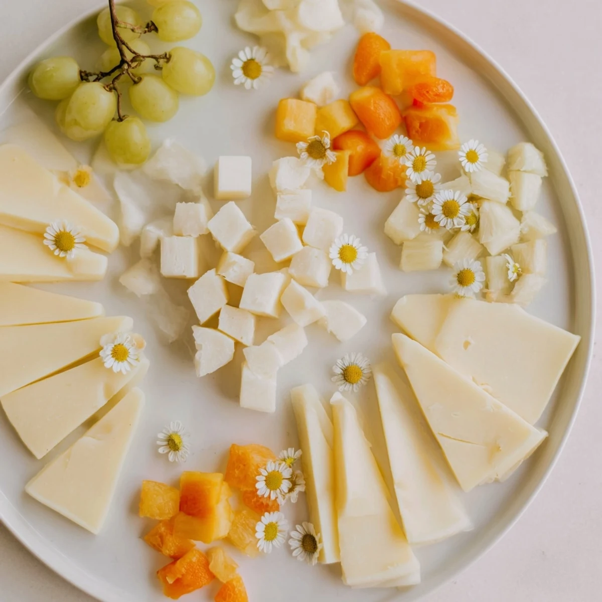 This Bridal Shower Bubbly Board features luscious cheeses, fruit, and bubbles, perfect for celebrating in style.