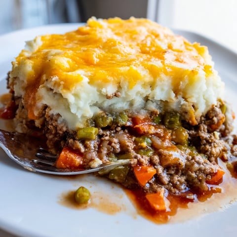 Golden brown, bubbling Warm Rustic Shepherds Pie with Cheesy Potato Topping pictured after baking.