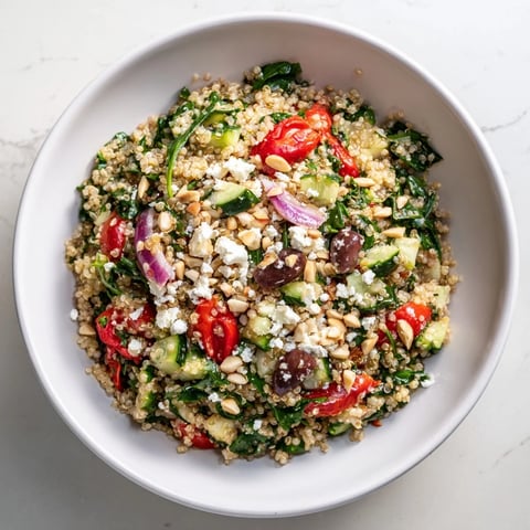 Mediterranean Grain Bowl with vibrant colors and a lemon-herb dressing, ready to eat.