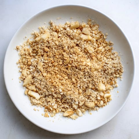 A close-up of a freshly baked soft crumb apple crisp, ready to be served warm.