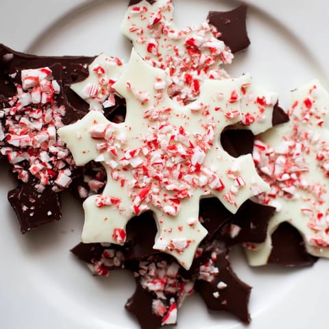Beautiful Peppermint Bark Snowflakes, a delightful dessert with vibrant colors, perfect for holiday celebrations.