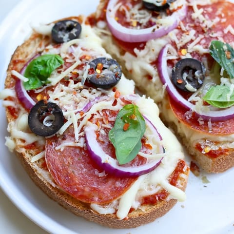 Golden-brown, bubbly cheese blankets perfectly toasted bread in this easy Pizza Toast 2.0 recipe.