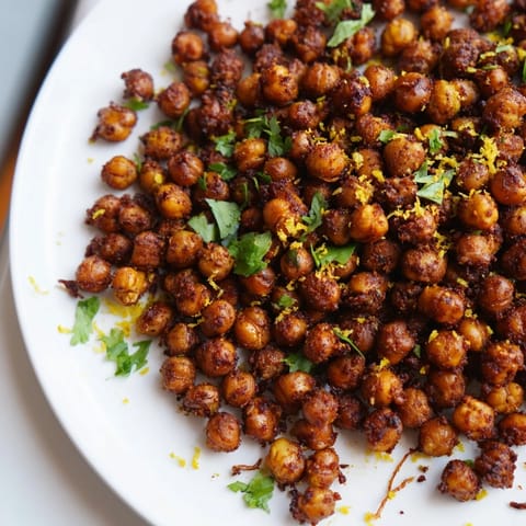 A freshly baked batch of flavorful Harissa Chickpea Roast, ready to enjoy as a vegan and gluten-free snack.