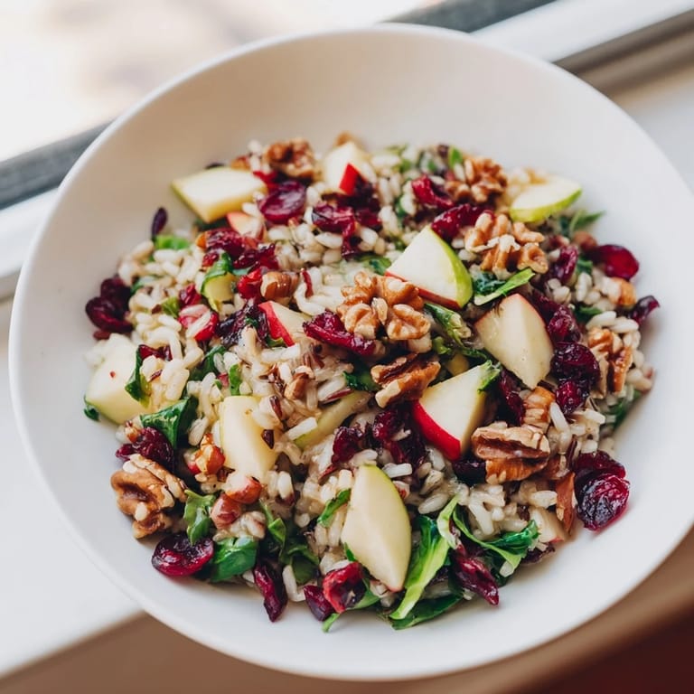 This vibrant Light Forest-Inspired Wild Rice and Cranberry Salad features colorful greens, wild rice, and tart cranberries.