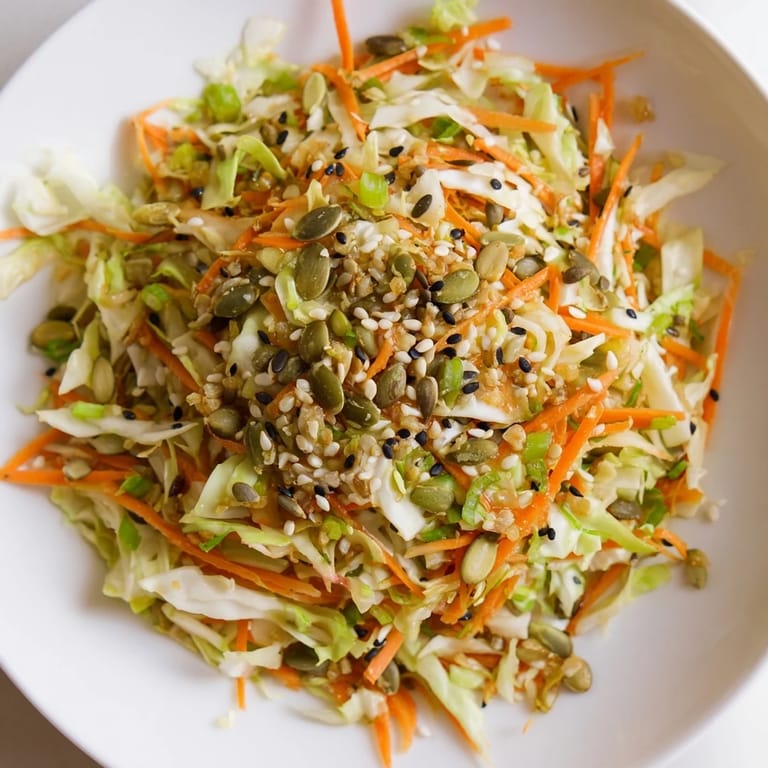 Beautifully plated Cabbage-Core Slaw Salad, featuring shredded cabbage cores and toasted seeds, ready to enjoy.