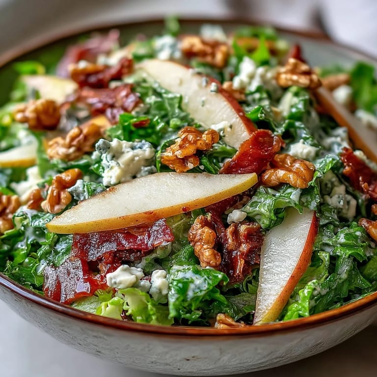 Torn frisée greens and sliced ripe pears topped with crumbled blue cheese make this salad.